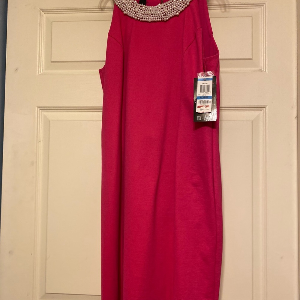 A Beautiful Hot Pink  Dress with a Pearl Neck Line.